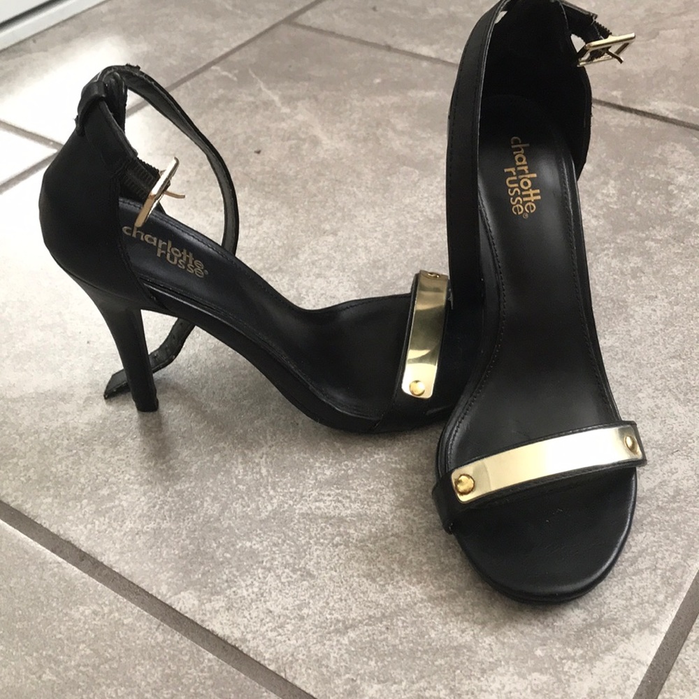Woman’s black and gold heels